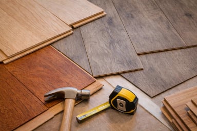 Variety of wooden floor samples with tools